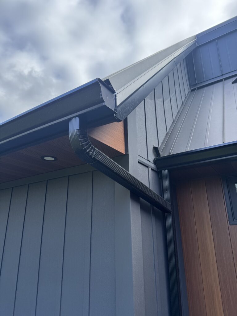 Home exterior project to install eavestroughs, gutter guards, siding, soffit and fascia performed by Distinct Exteriors in Tillsonburg Ontario.